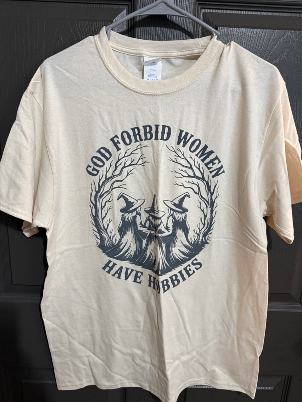 Graphic Tee – 'God Forbid Women Have Hobbies' in Cream